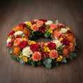 Couronne florale – Dominante rouge, nuances d’orange et de jaune