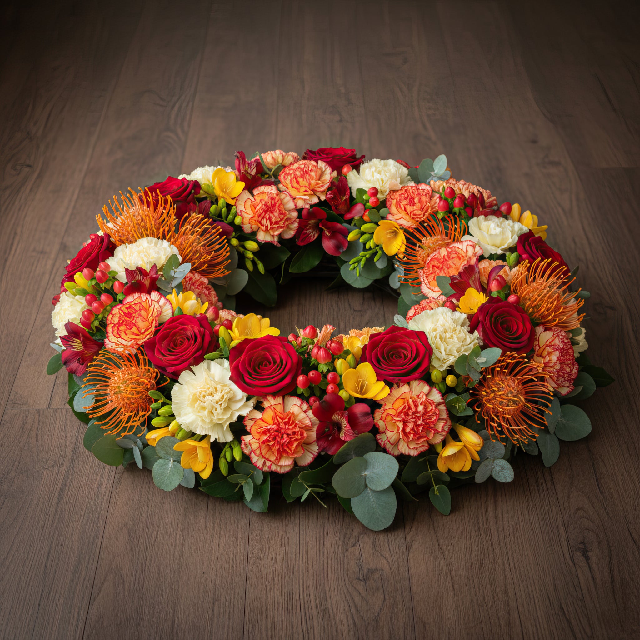 Couronne florale – Dominante rouge, nuances d’orange et de jaune