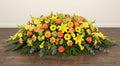 Coussin Premium – Dominante jaune, nuances d'orange et touches de vert