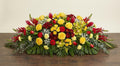 Coussin Premium – Dominante jaune, nuances de rouge et touches de blanc