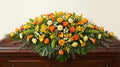 Raquette funéraire – Dominante jaune, touches d'orange