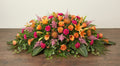 Coussin Premium – Dominante orange, nuances de rose