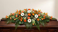 Raquette funéraire – Dominante orange, touches de blanc