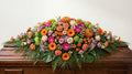 Raquette funéraire – Dominante orange, touches de rose