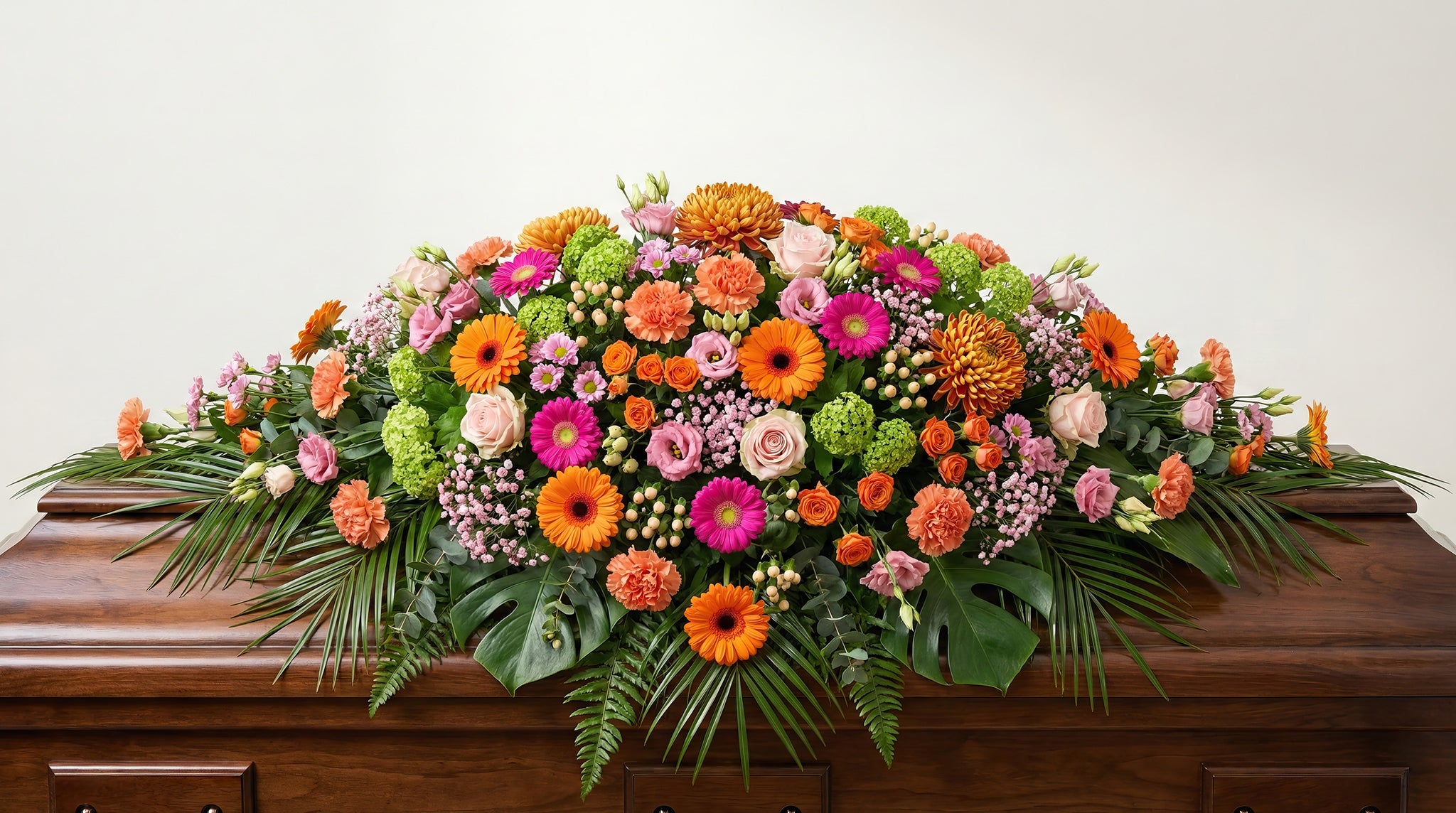 Raquette funéraire – Dominante orange, touches de rose