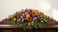 Raquette funéraire – Dominante orange, touches de violet