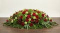 Coussin Premium – Dominante verte, nuances de rouge