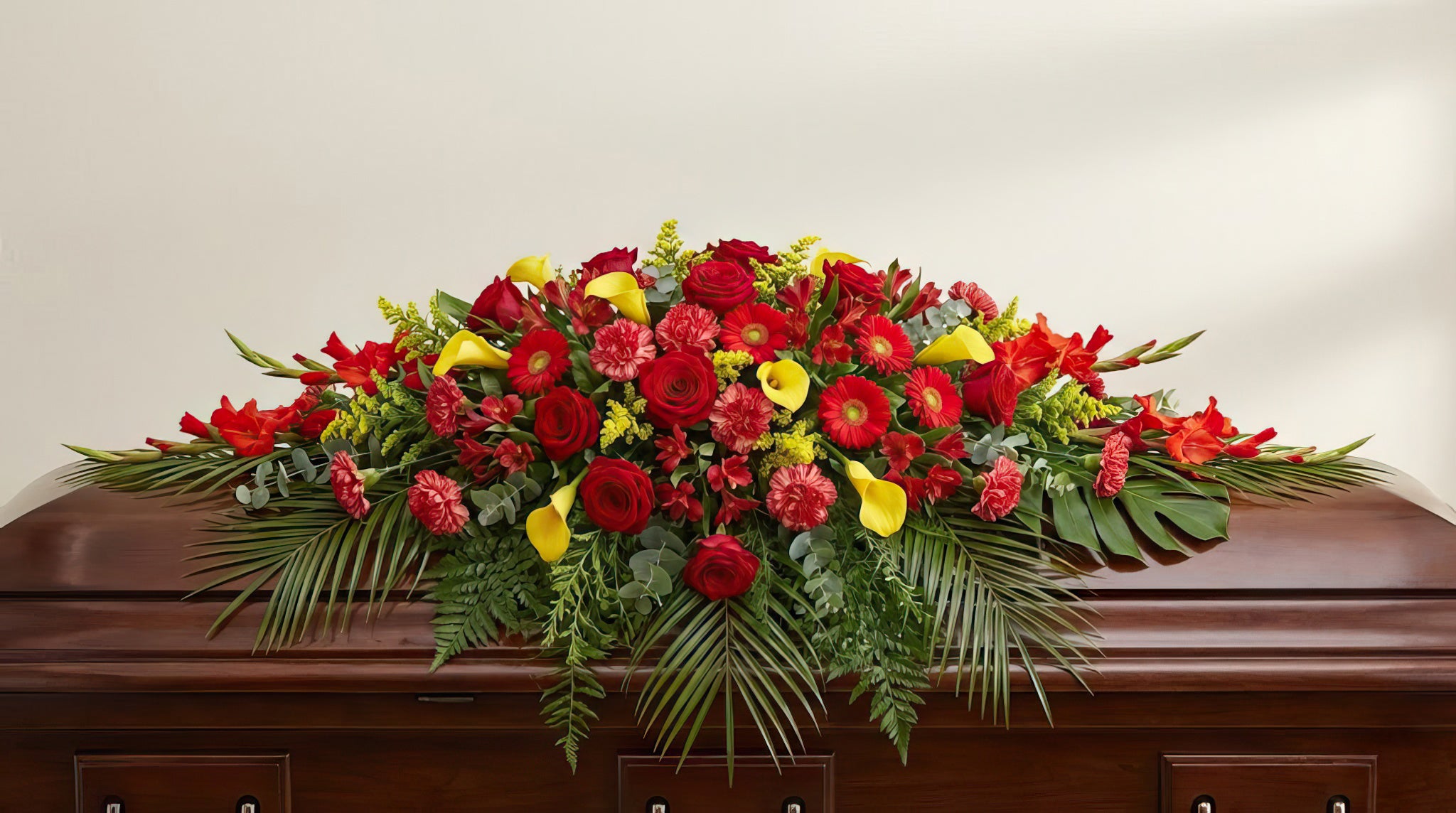 Raquette funéraire – Dominante rouge, touches de jaune